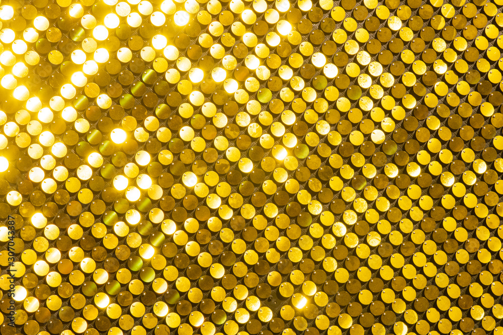 Naklejka premium Sequins reflective background. golden Sequins wall, Sparkling