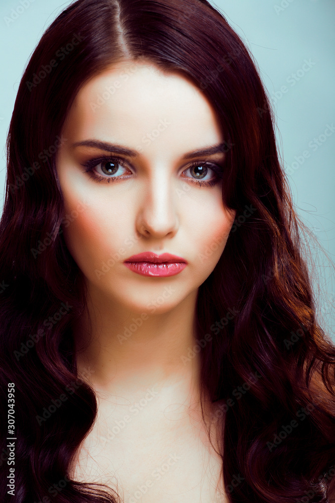 Fototapeta premium young pretty brunette woman with hairstyle waves, luxury look fashion makeup close up