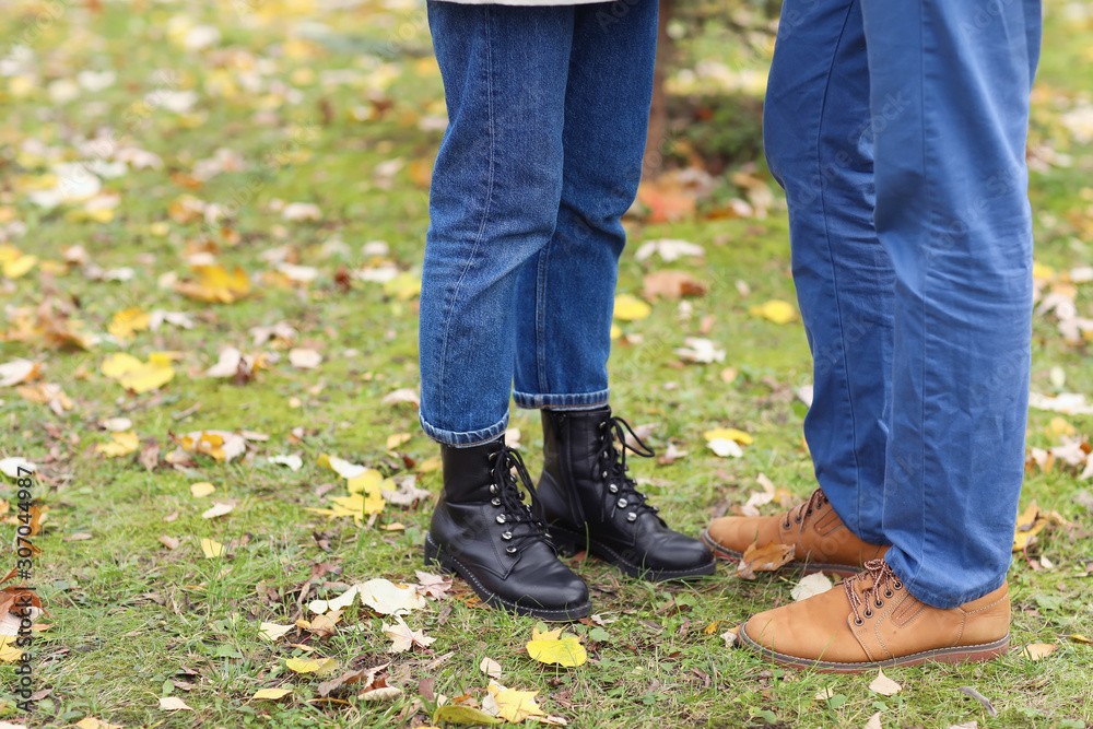 Happy couple resting in autumn park Happy couple resting in autumn park