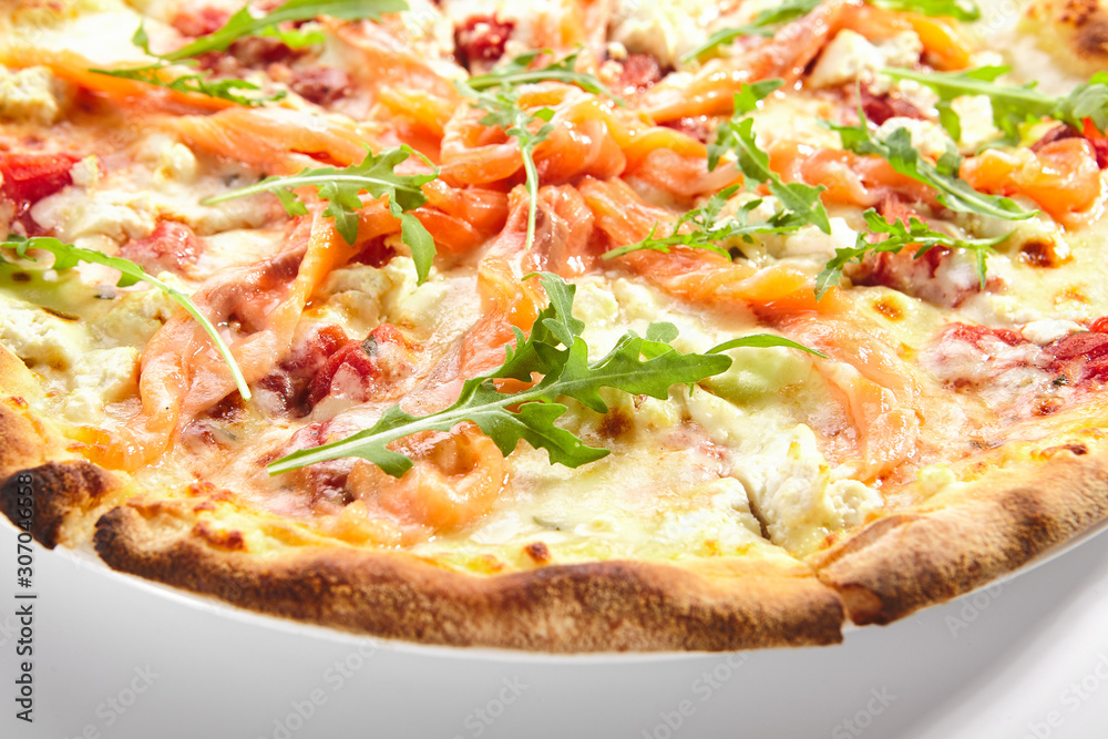 Pizza with Salmon, Cream Cheese and Fresh Rucola Leaves Isolated Side View Pizza with Salmon, Cream Cheese and Fresh Rucola Leaves Isolated Side View
