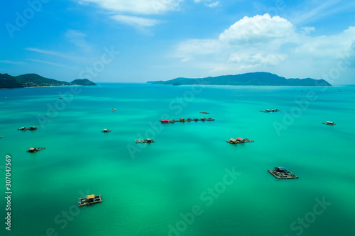 Top View Tropical Island , Aerial view of long-tailed boat on the sea in Phuket Thailand.