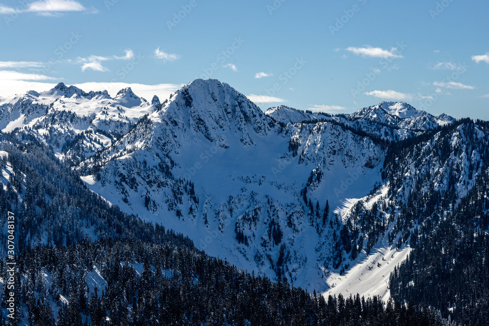 Blue Sky Mountain Background with Powder Snow Covered Peak