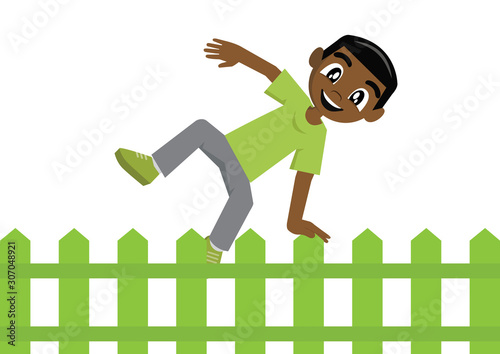 African Boy jumping over fence.