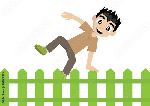 Boy jumping over fence.