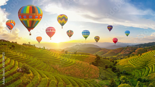 Colorful Hot Air Balloons. Beautiful Sunset scene at Pa Bong Piang terraced rice fields, Mae Chaem, Chiang Mai Thailand