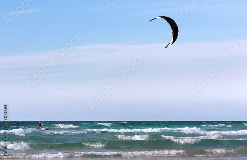 Seascape with kite against sky as background