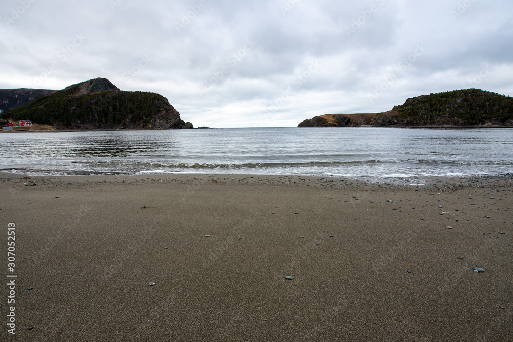 Sandy beach with calm ocean