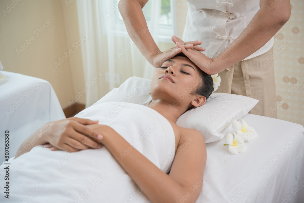 young woman getting spa treatment at beauty salon. spa face massage. facial beauty treatment. spa salon. young woman getting spa treatment at beauty salon. spa face massage. facial beauty treatment. spa salon.