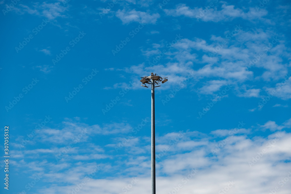 Low Angle View Of Street Lamps Against Clear Blue Sky Low Angle View Of Street Lamps Against Clear Blue Sky