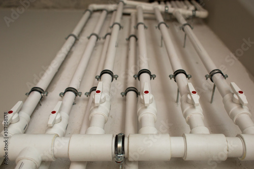 clean line white water pipes watering system pipe engineer design in underground. plastic white pipe heating manifold