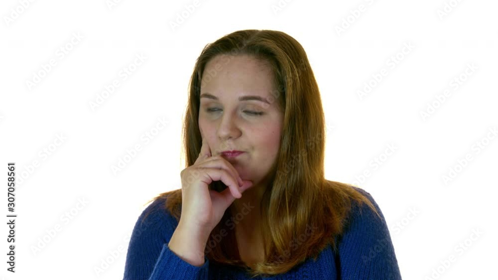 Thoughtful overweight woman in studio with hand near the face looking around. Isolated on white background. Thoughtful overweight woman in studio with hand near the face looking around. Isolated on white background.