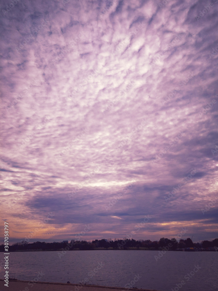 Fototapeta premium sunset over city lake