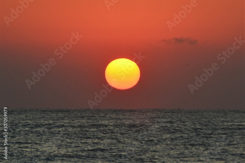the sun like a ball rising from the sea © sebi_2569