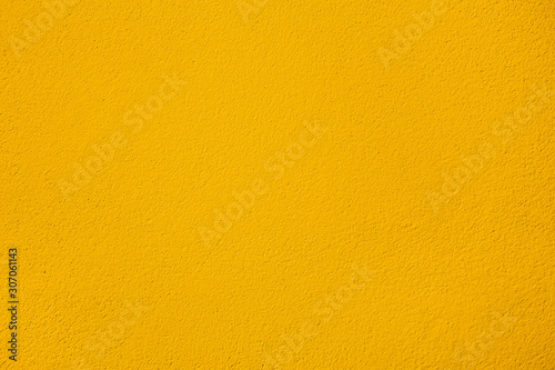 Colour yellow paint on concrete texture. cement wall surface. Banner backdrop interior design or add text message background.