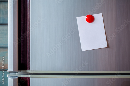 Empty paper sheet on refrigerator door. Note paper with magnetic. Valentine send text love message. Memory day note story everyday. photo