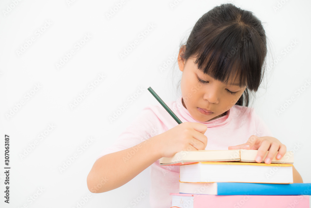 The girl is writing a book happily. The girl is writing a book happily.