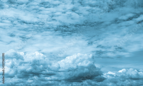 Beautiful blue sky and white cumulus clouds abstract background. Cloudscape background. Blue sky and fluffy white clouds on sunny day. Nature weather. Bright day sky for happy day background.