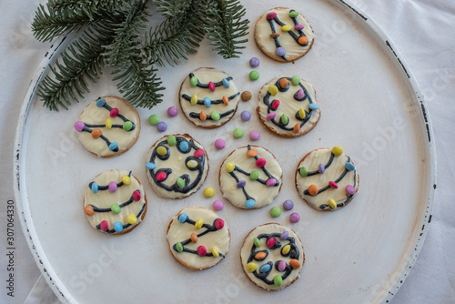 Traditional home made Christmas Lights Cookies on a festive christmas background