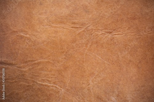 old and dirty genuine leather texture in vintage tone and vignette for the backdrop.