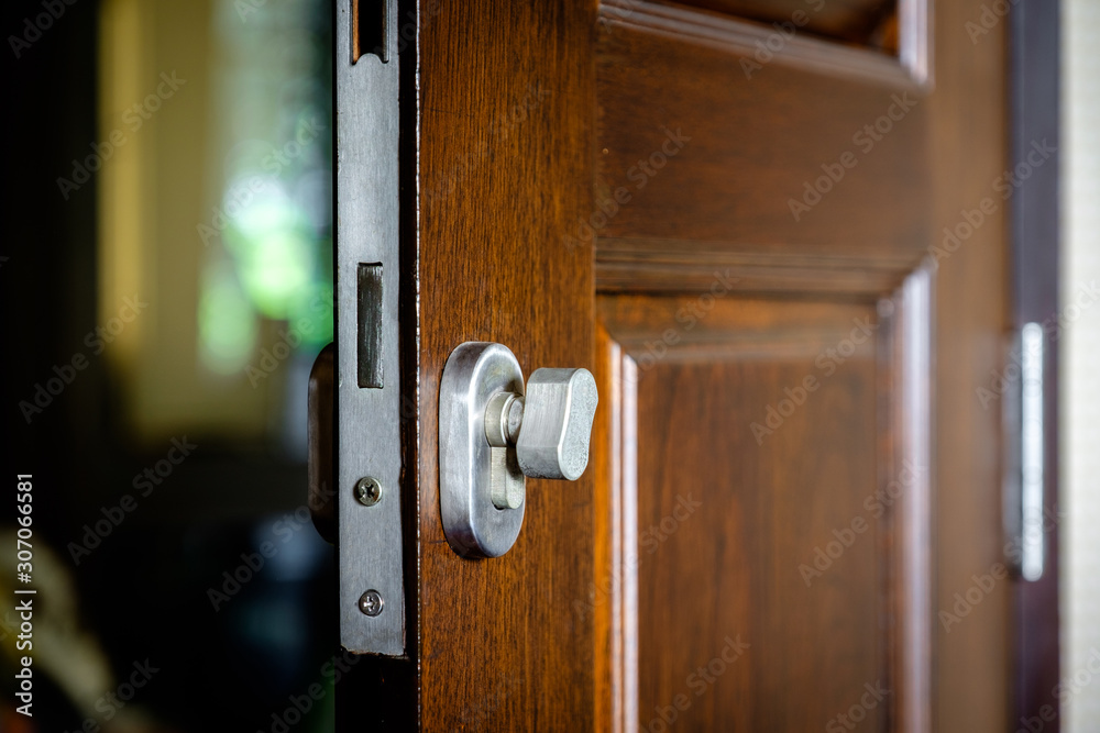 Obraz premium Door lock attached to the wooden door
