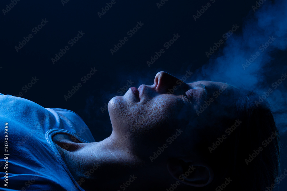 Beauty treatment of face with ozone facial steamer in beauty center. Blue backlight. Beauty treatment of face with ozone facial steamer in beauty center. Blue backlight.