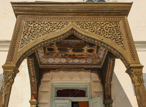 The ceiling in the form of a dome in a traditional ancient Asian mosaic. The details of the architecture of medieval Central Asia