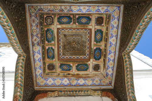 The ceiling in the form of a dome in a traditional ancient Asian mosaic. The details of the architecture of medieval Central Asia