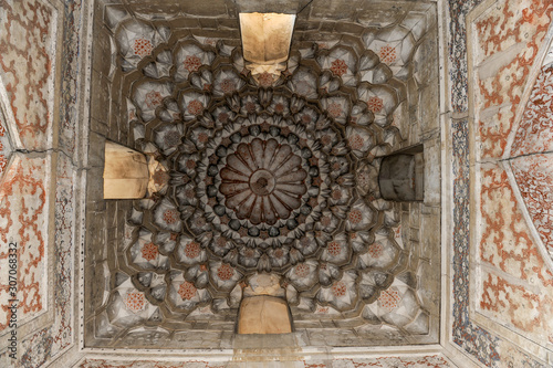 The ceiling in the form of a dome in a traditional ancient Asian mosaic. The details of the architecture of medieval Central Asia