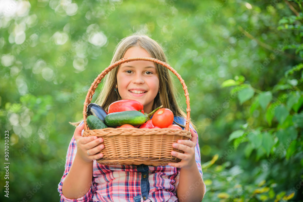 Gmo free. Kid gathering vegetables nature background. Eco farming. Girl cute smiling child living healthy life. Healthy lifestyle. Healthy homegrown food concept. Eat healthy. Summer harvest concept Gmo free. Kid gathering vegetables nature background. Eco farming. Girl cute smiling child living healthy life. Healthy lifestyle. Healthy homegrown food concept. Eat healthy. Summer harvest concept
