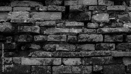Old brick wall with vignetting of dark or black blur border gradient in bw or black and white tone for backdrop or background.