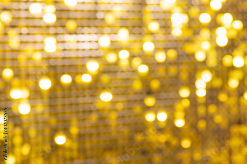 Abstract blur sequin dress colorful bokeh goldren light. Design backdrop. Disco color photo