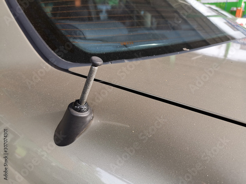 Car radio antenna on car. photo