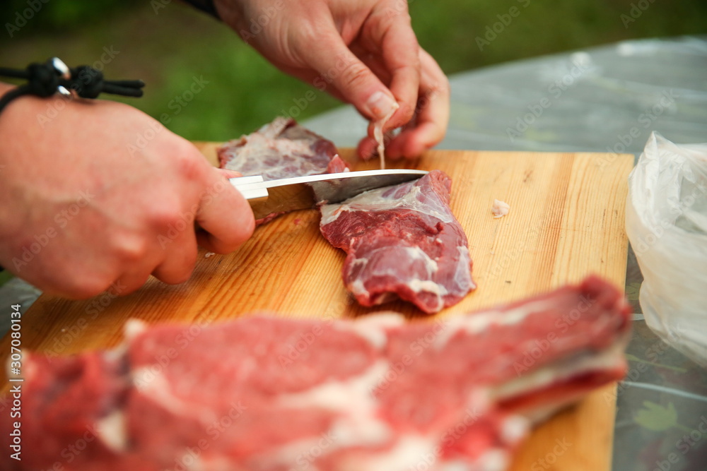 raw beef meat on a cutting board