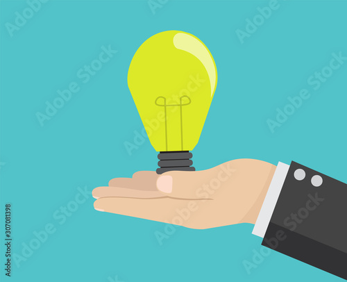 Hand holding idea light bulb.