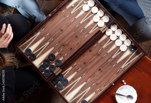 Canvastavla Flat lay of two people playing backgammon game while drinking tea