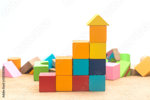 Wooden blocks built on wooden boards and faded brick backgrounds