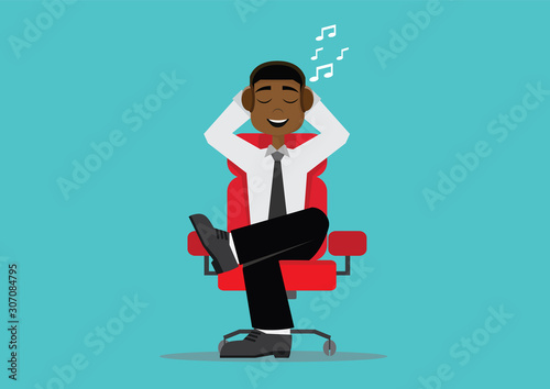 African businessman relax by listening to music at work chair.