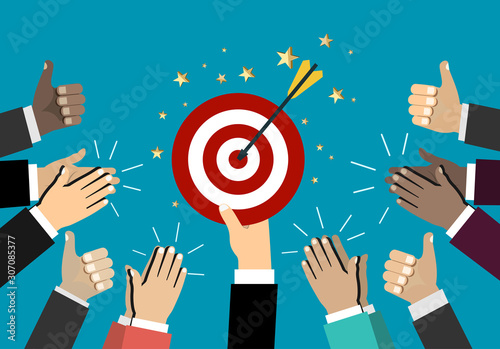 Businessman holding up a winning target. Business concept