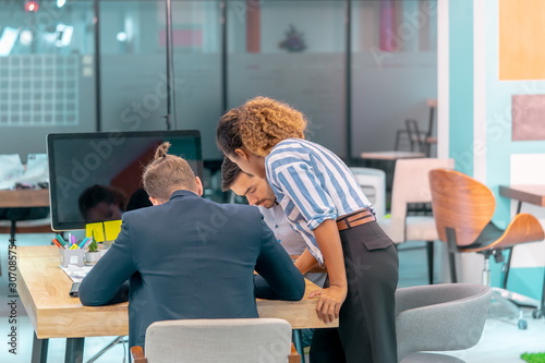 Team of young Business starter is brainstroming in office photo