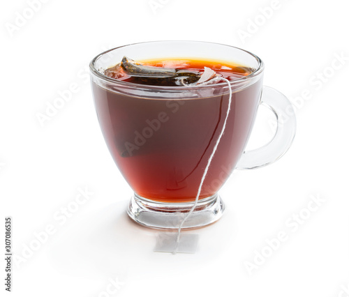 Cup of black tea with tea bag isolated on white