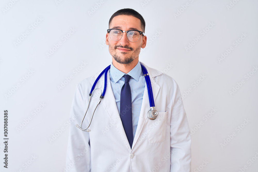 Young doctor man wearing stethoscope over isolated background smiling looking to the side and staring away thinking.