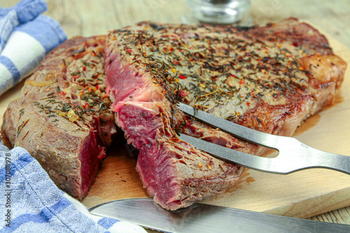grilled rib of beef on a cutting board