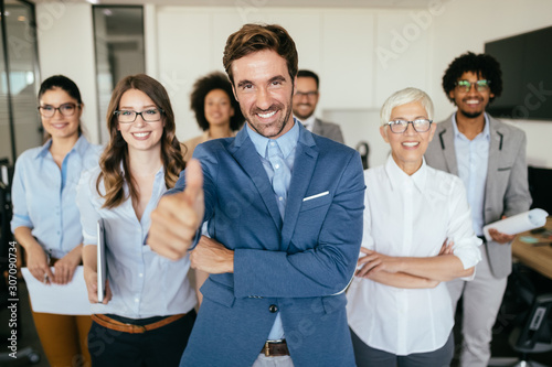 Group of successful business people in office