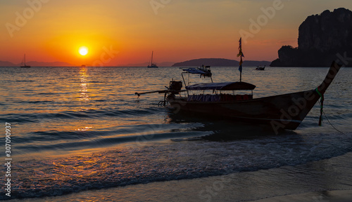 Long tail boat summer golden sunset