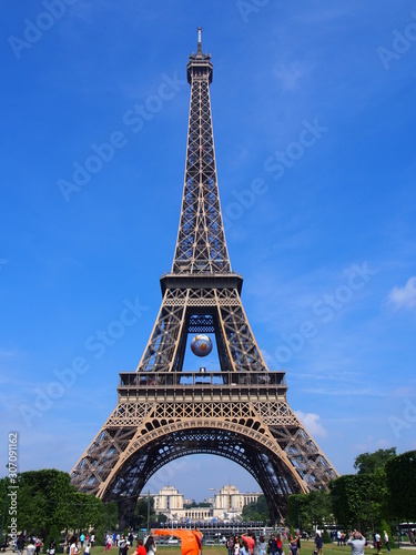 View of the Eiffel Tower with a large soccer ball hanging there, Paris, France