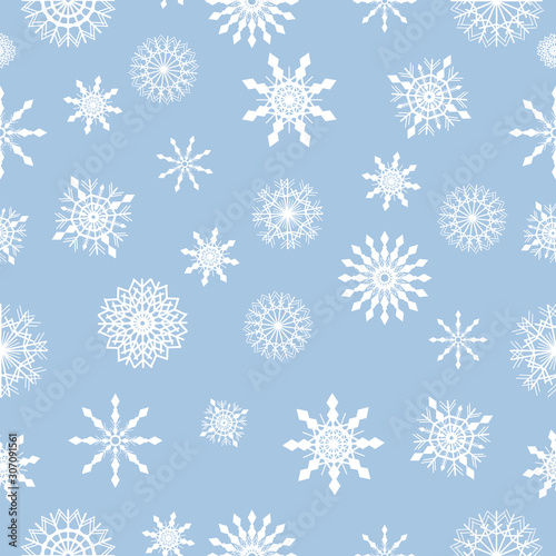 Seamless vector winter pattern with snowflakes on the light blue background