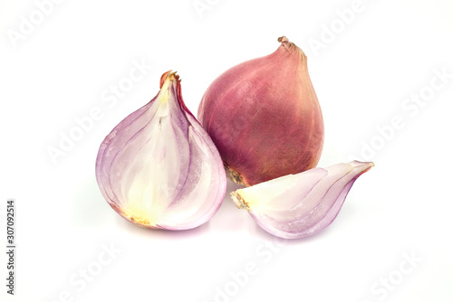 Close-up of Sliced red whole onions with half isolated on white background.
