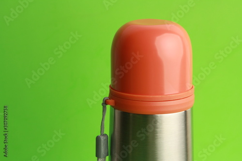 orange thermos to keep the drink hot