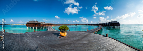 Fototapeta Naklejka Na Ścianę i Meble -  Maldives island with beach water bungalows and palm trees, South Male Atoll, Maldives