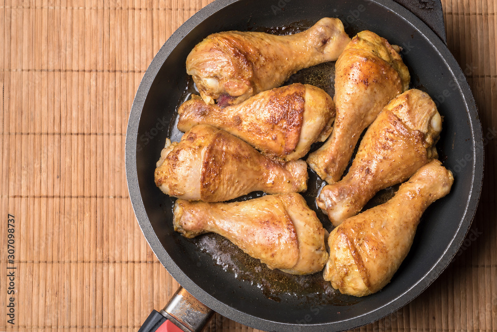 Chicken drumsticks baked on a pan Chicken drumsticks baked on a pan